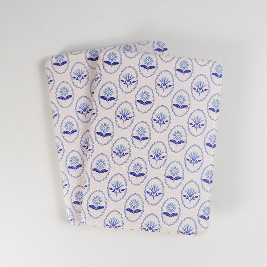 Multiple Bloom Service Kindle Cases with repeating blue floral pattern and framed flower design on beige background by Elco House
