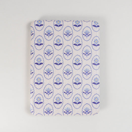 Bloom Service Kindle Case with repeating blue floral pattern and framed flower design on beige background by Elco House